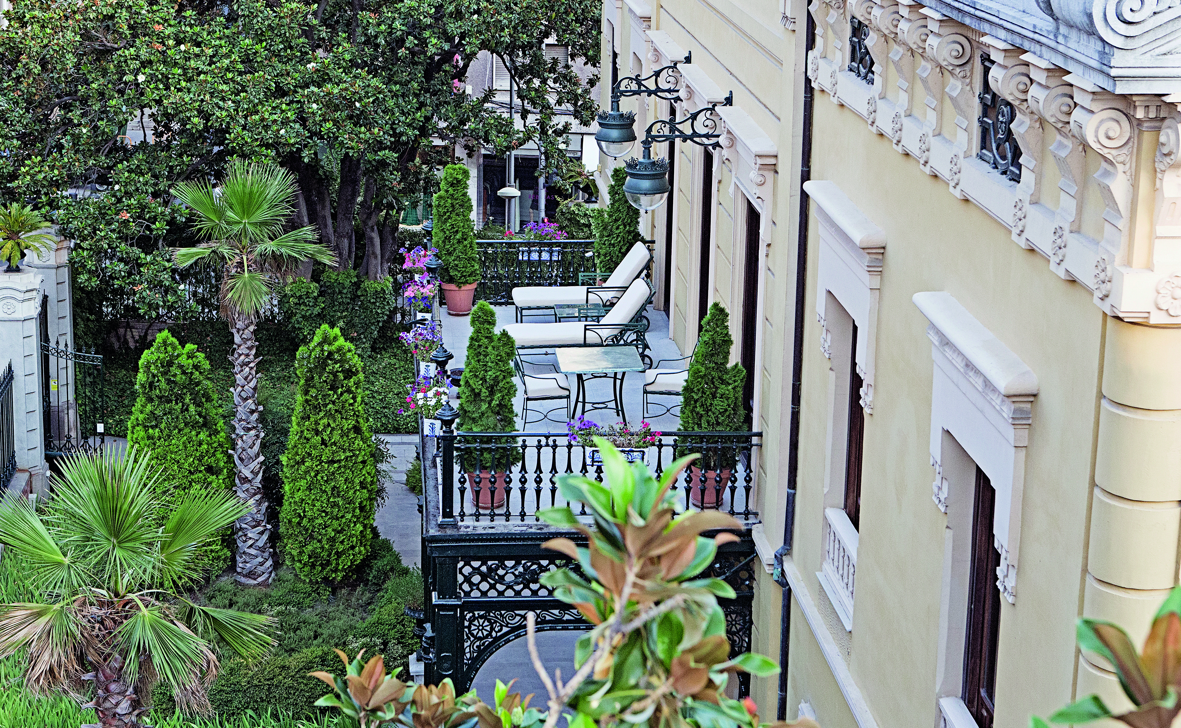 Palacio de los Patos Granada balcony outdoor seating sun loungers trees
