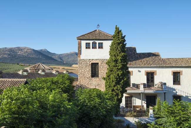 Cortijo de Marques Andalucia hotel exterior trees mountain in background