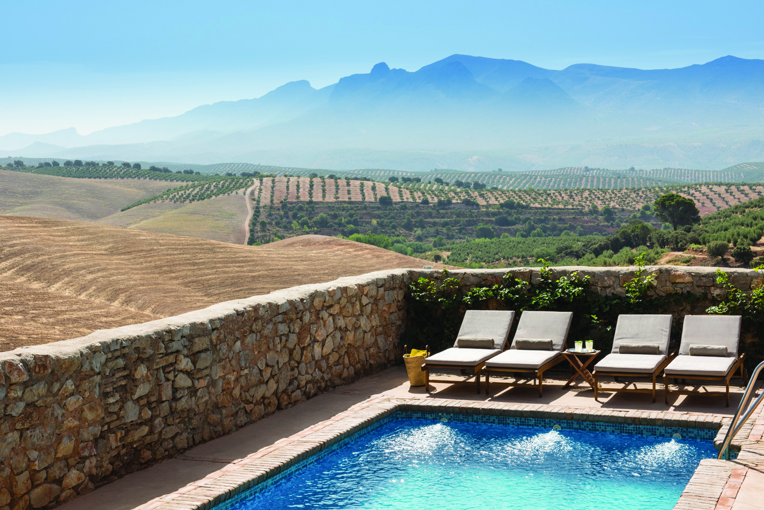 Cortijo de Marques Andalucia pool sun loungers countryside surrounds mountains in distance 