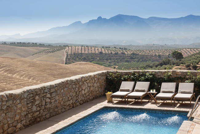 Cortijo de Marques Andalucia pool sun loungers countryside surrounds mountains in distance 