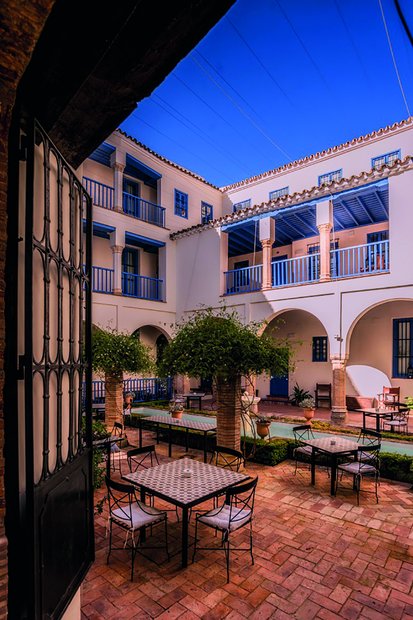 Las Casas de la Juderia Andalucia courtyard outdoor seating area plants and shrubbery