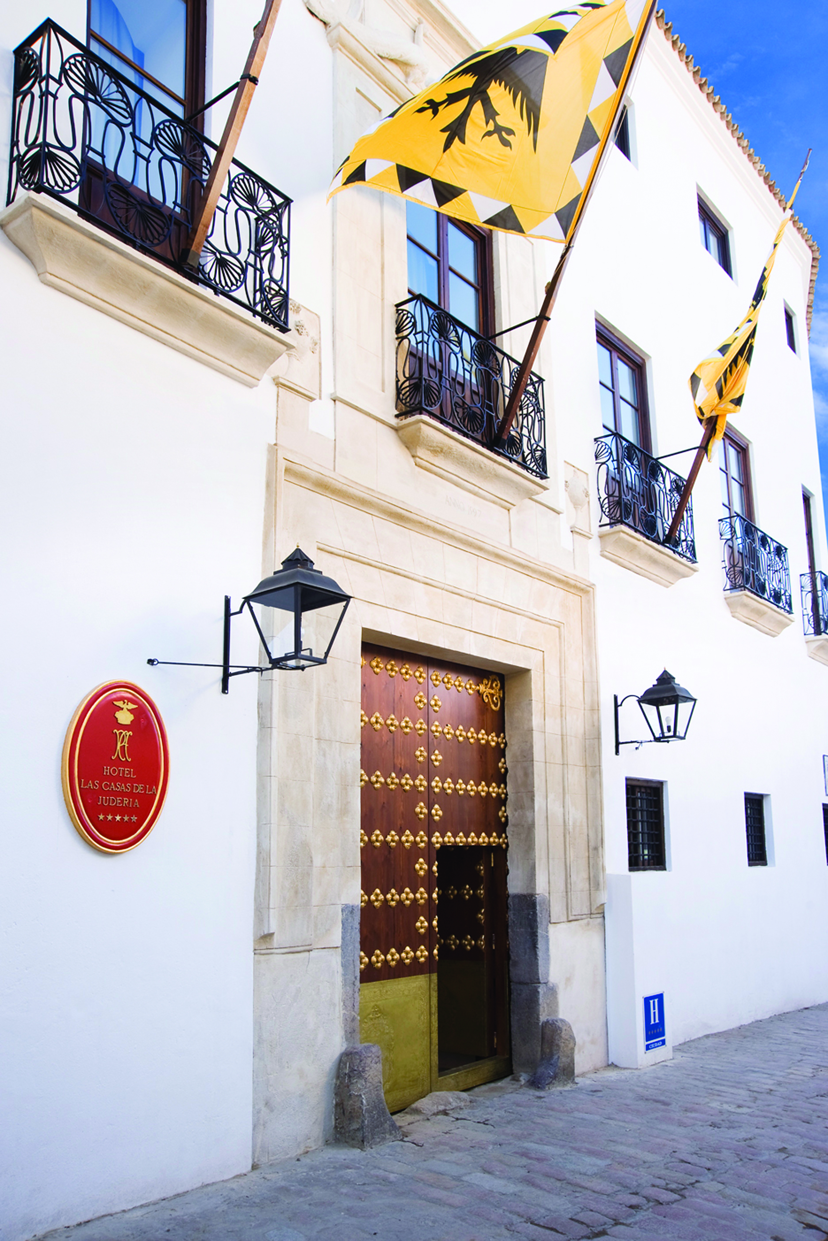 Las Casas de la Juderia Andalucia entrance hotel door white walls