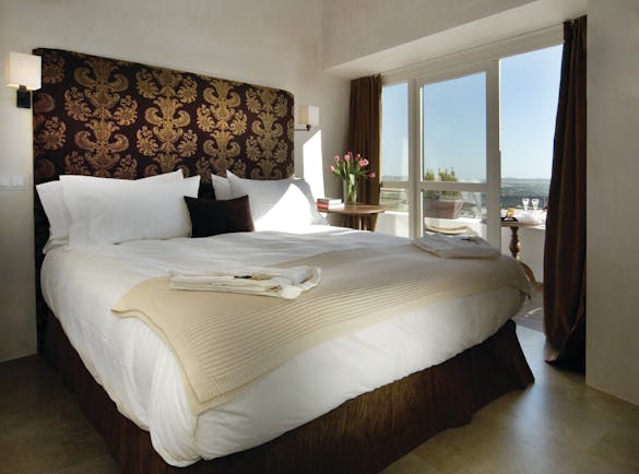 Hotel V Andalucia guest room large bed doors leading to balcony modern décor