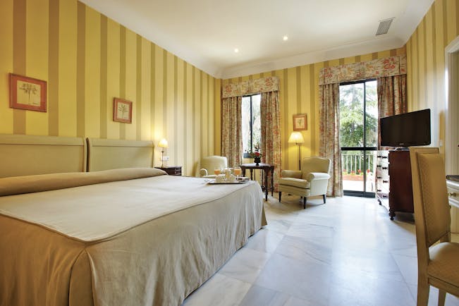 Villa Jerez Andalucia double room bed armchairs modern décor
