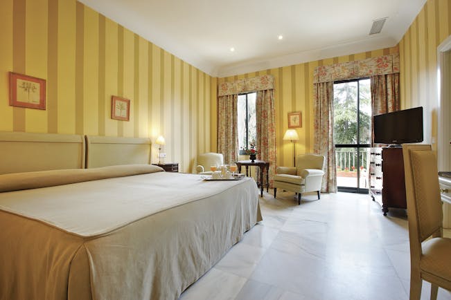 Villa Jerez Andalucia double room bed armchairs modern décor