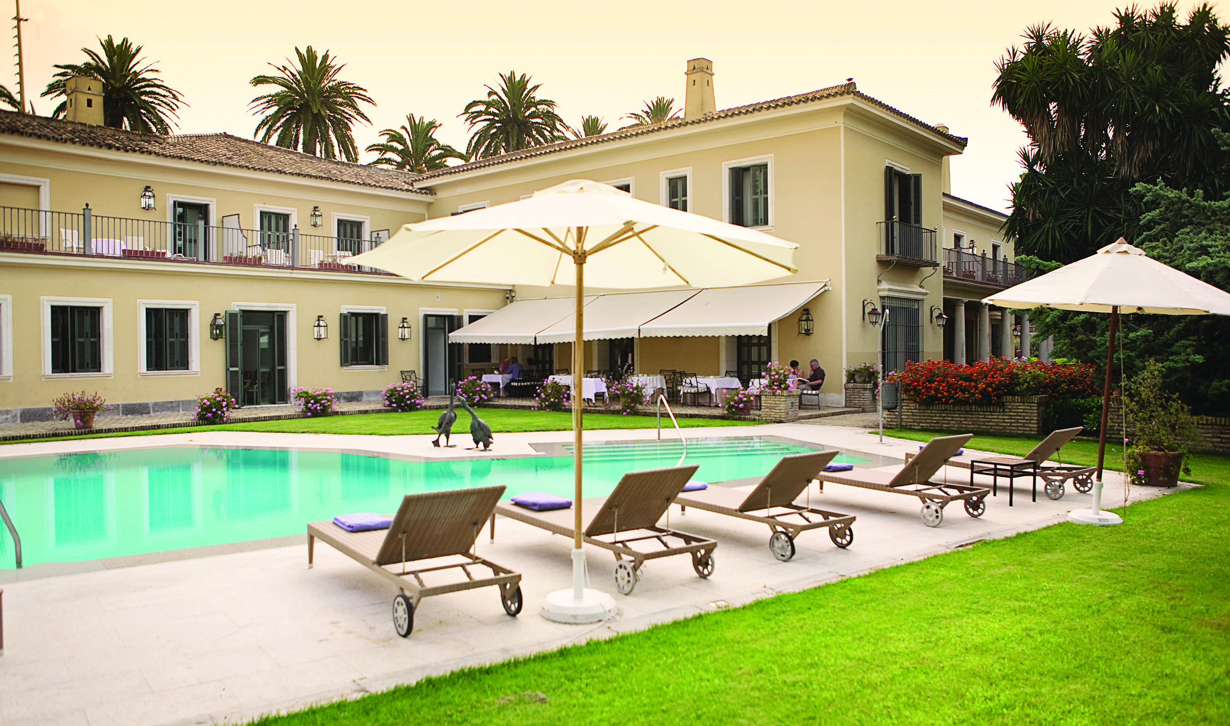 Villa Jerez Andalucia pool sun loungers umbrellas lawn