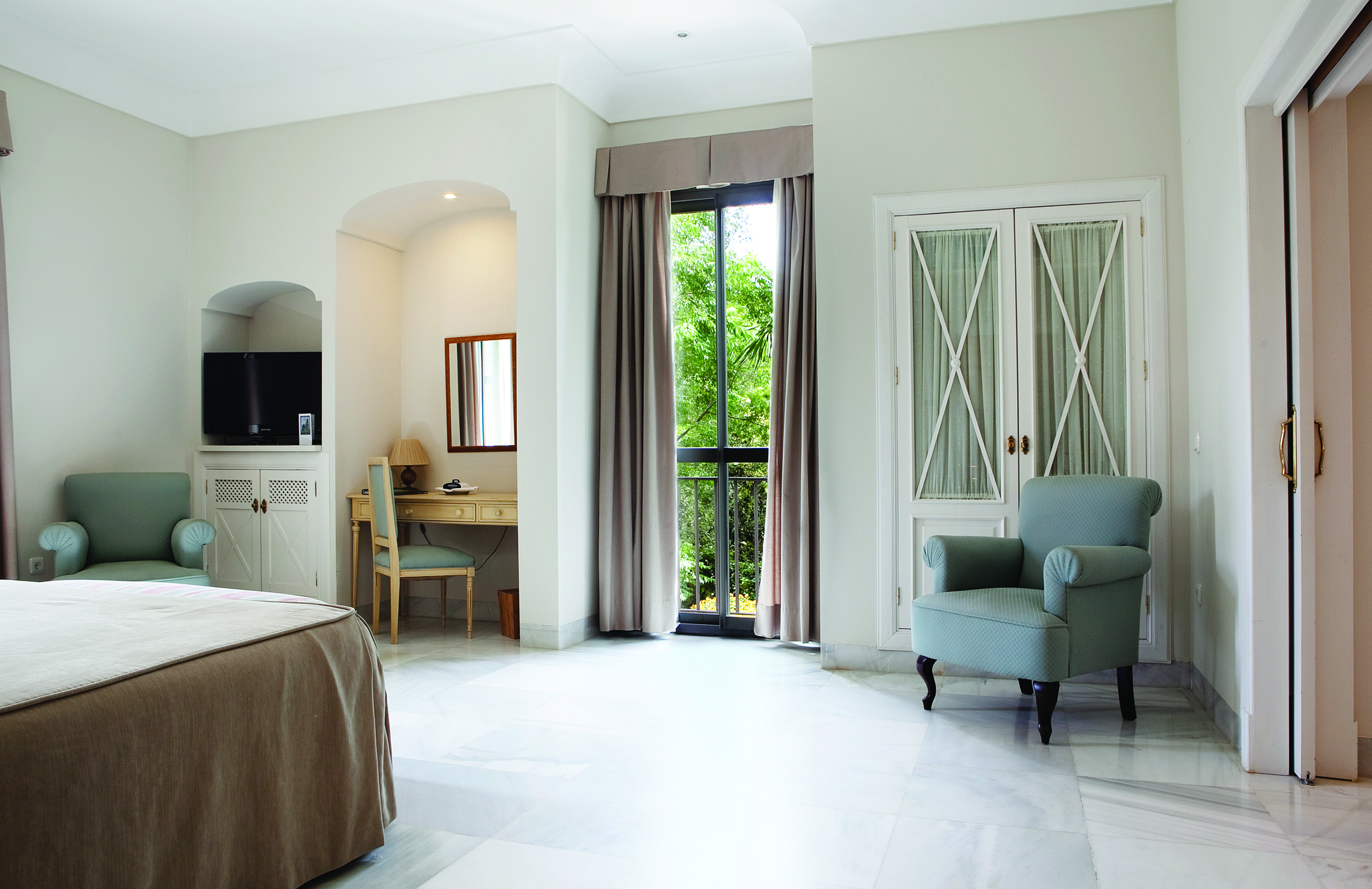 Villa Jerez Andalucia superior room bed armchairs elegant décor