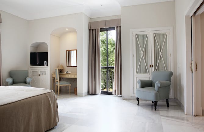 Villa Jerez Andalucia superior room bed armchairs elegant décor