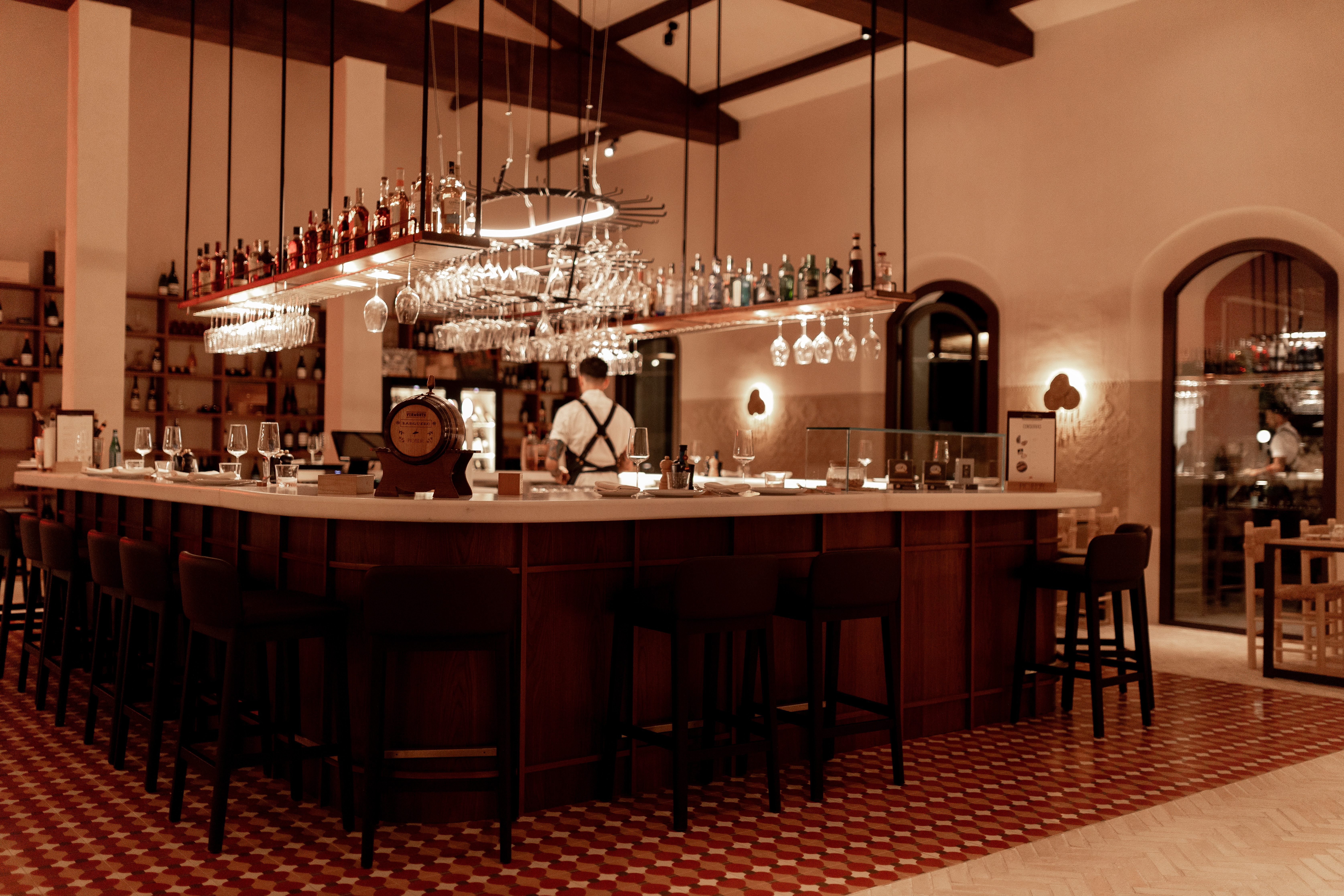 La Zambra Resort Picador Restaurant bar with atmospheric lighting and dark wood bar stools