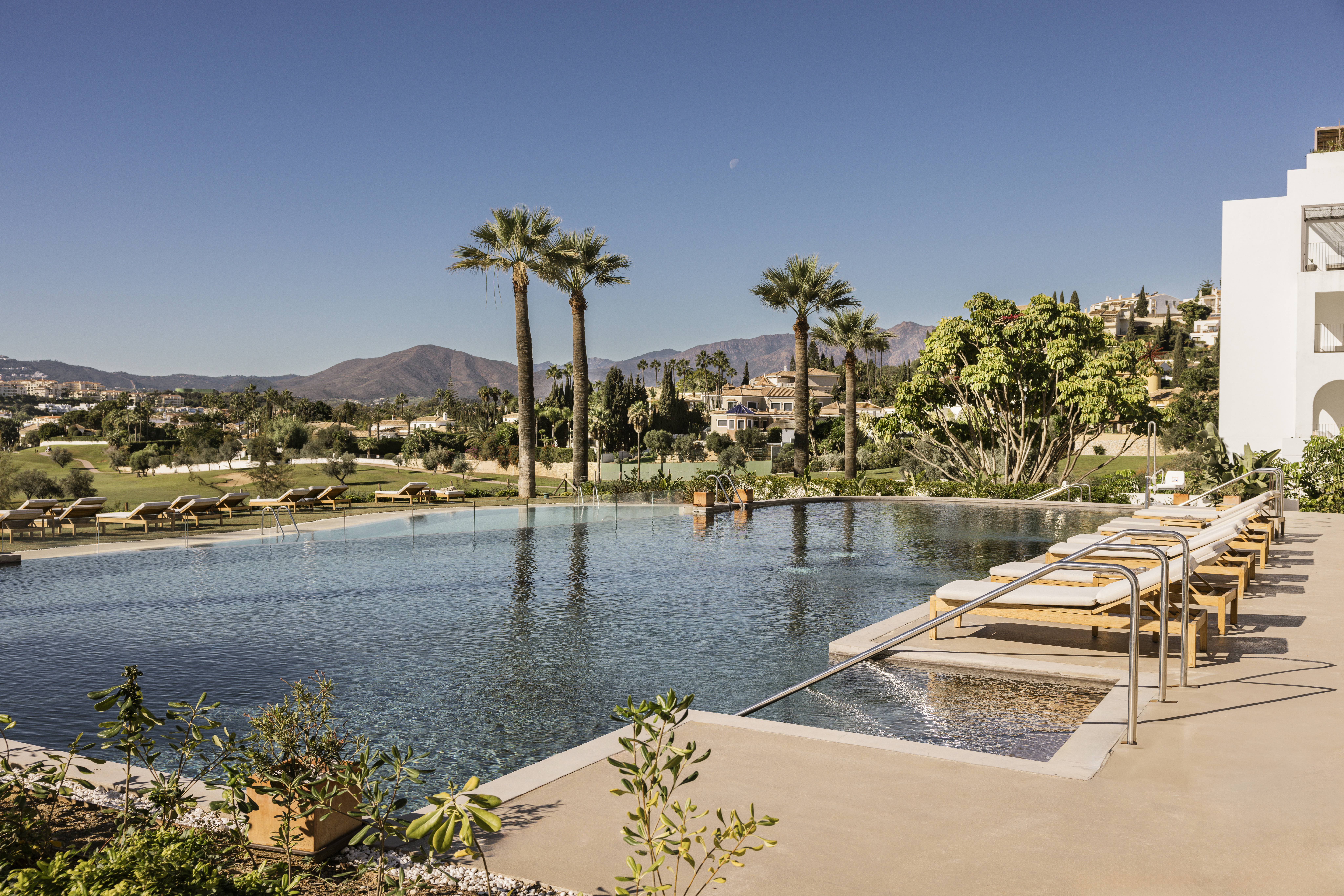 La Zambra Resort Palmito pool with sun loungers and palm trees
