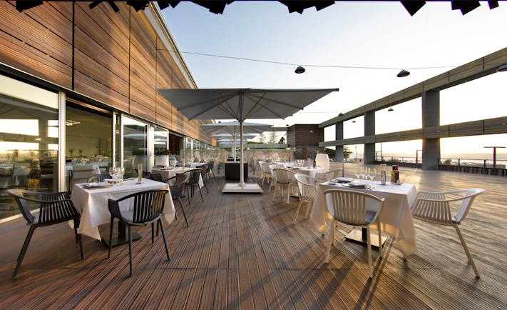 Parador de Cadiz Hotel Atlantico dining terrace, wooden decking, tables, chairs, sea views