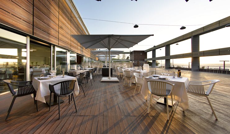 Parador de Cadiz Hotel Atlantico dining terrace, wooden decking, tables, chairs, sea views