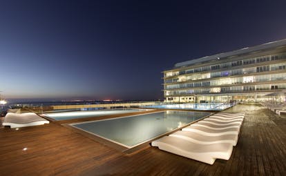 Parador de Cadiz Hotel Atlantico pool, sun loungers, hotel building