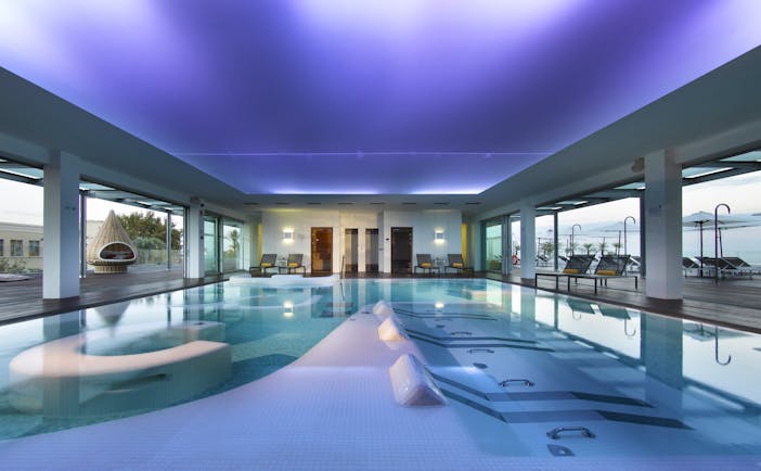 Parador de Cadiz Hotel Atlantico spa, indoor spa pool, decking leading to outdoor pool