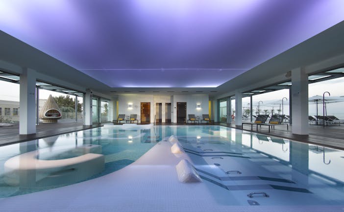 Parador de Cadiz Hotel Atlantico spa, indoor spa pool, decking leading to outdoor pool