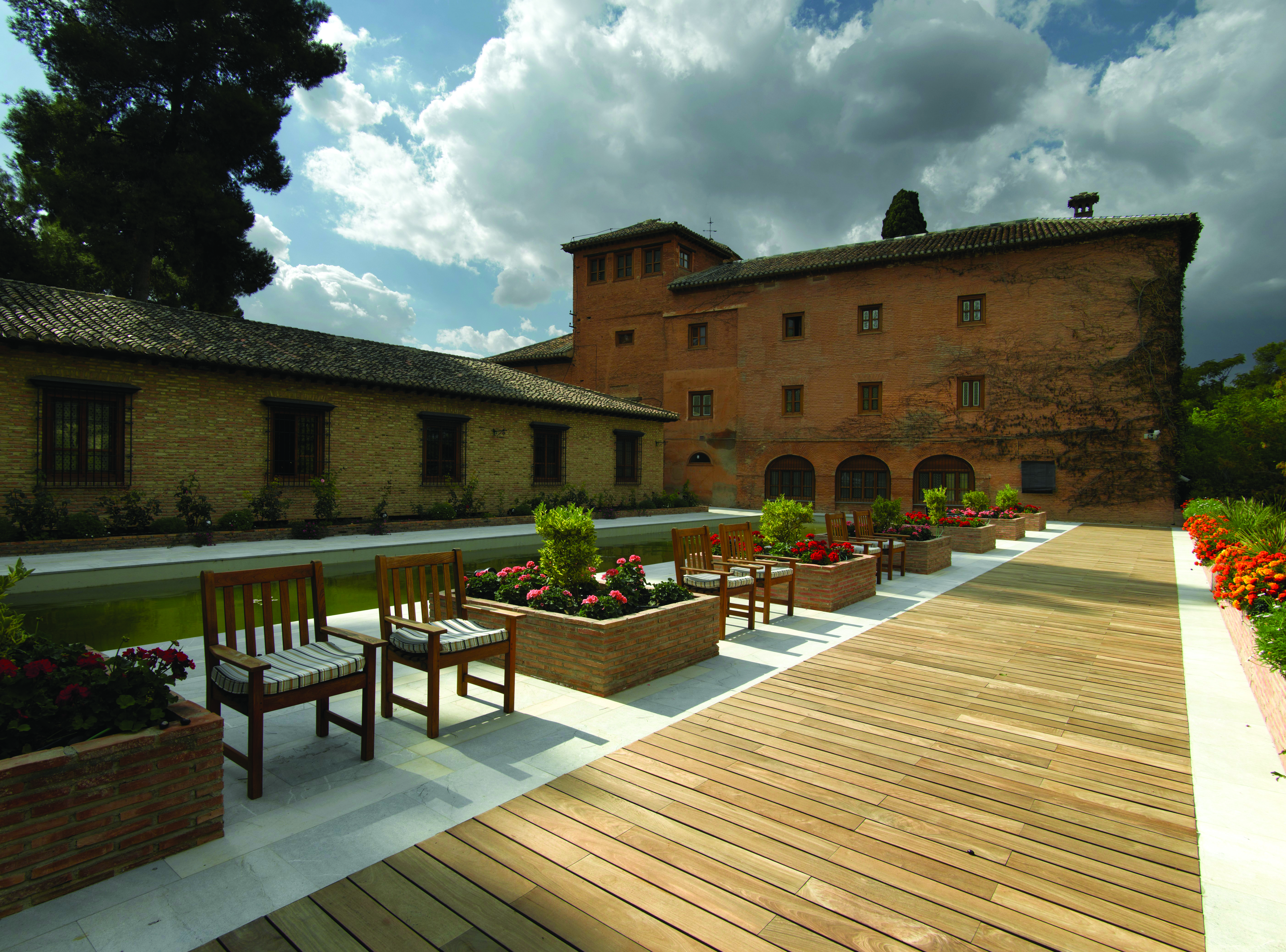 Parador de Granada exterior ancient building modern gardens walkway flowers