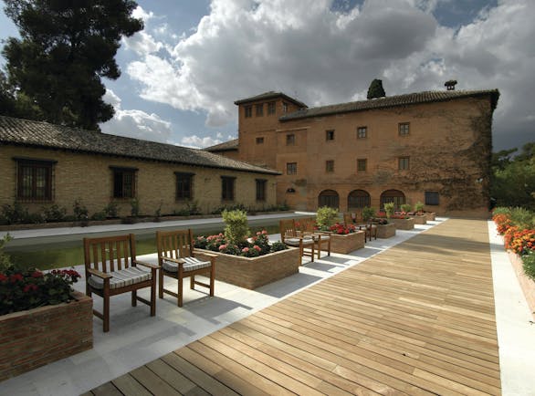 Parador de Granada exterior ancient building modern gardens walkway flowers
