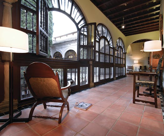 Parador de Granada hallway indoor seating floor tiles ornate windows