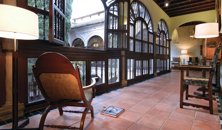 Parador de Granada hallway indoor seating floor tiles ornate windows
