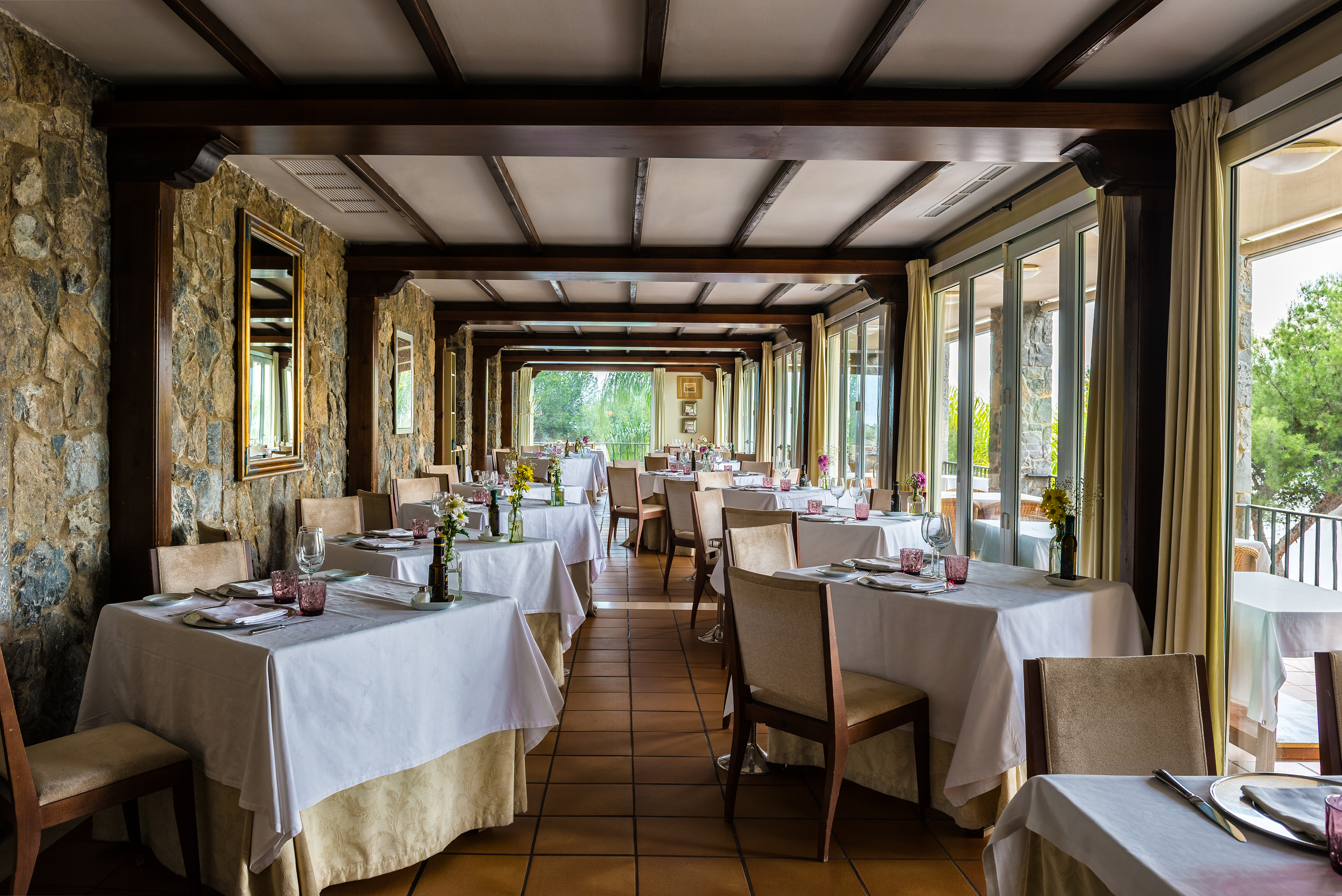 Parador de Malaga Gibralfaro restaurant, dining tables, chairs, traditional decor