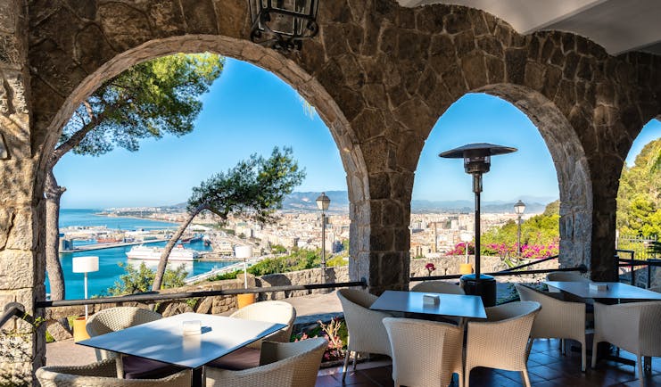 Parador de Malaga Gibralfaro terrace cafe, outdoor covered dining area, overlooking coast