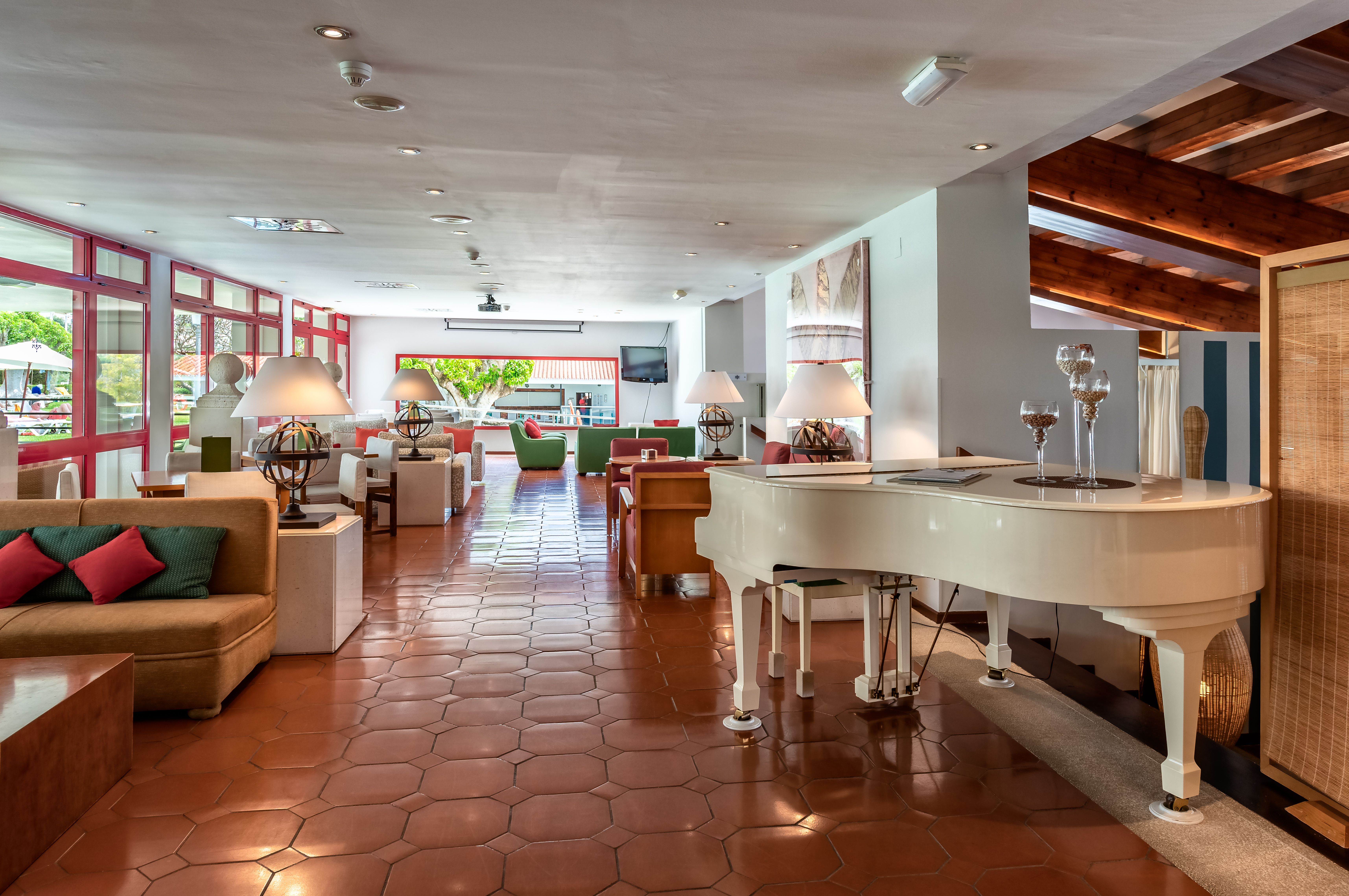 Parador de Nerja bar, baby grand piano, sofas, tiled floor