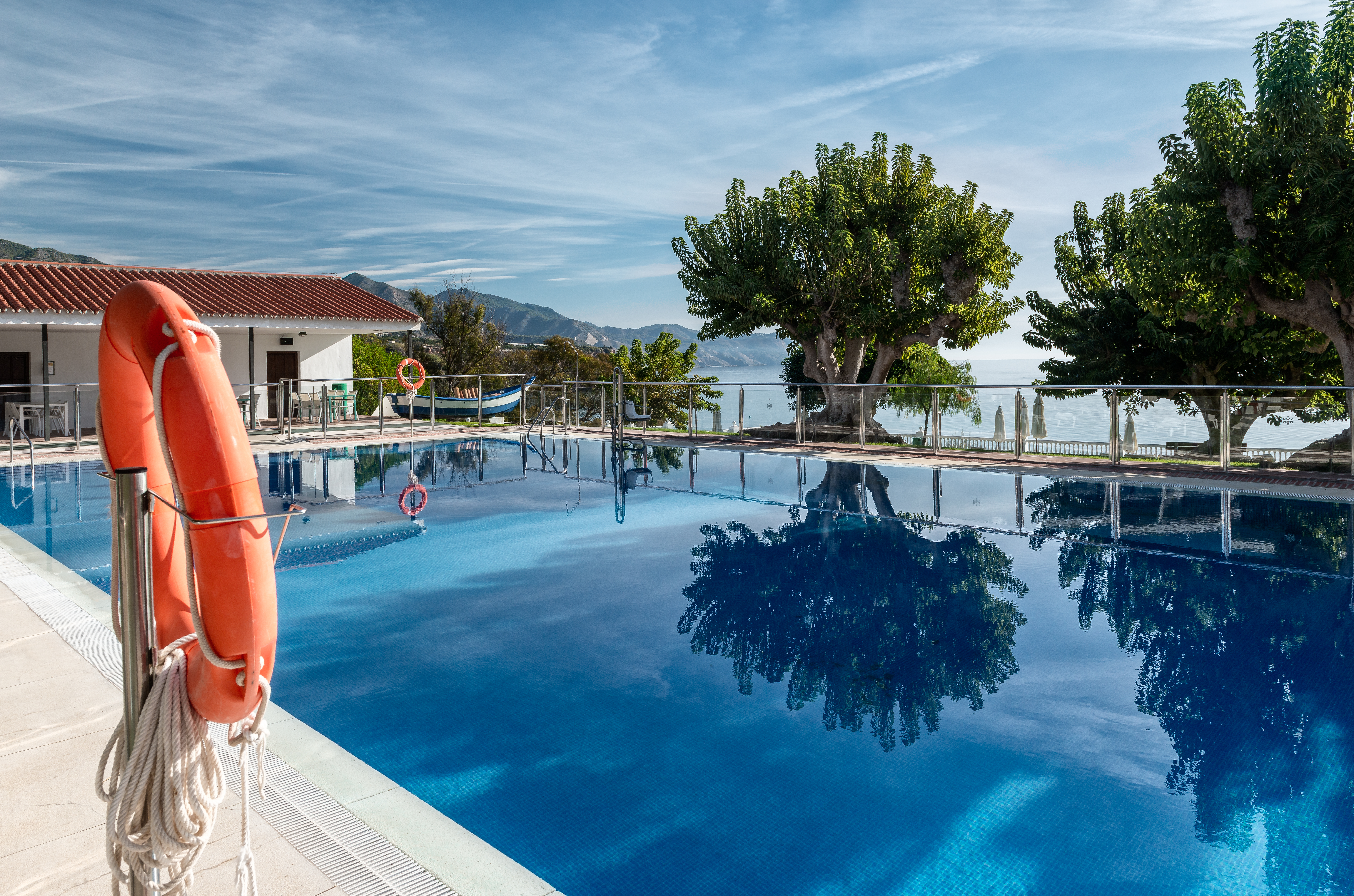 Parador de Nerja pool, lake and mountains in background