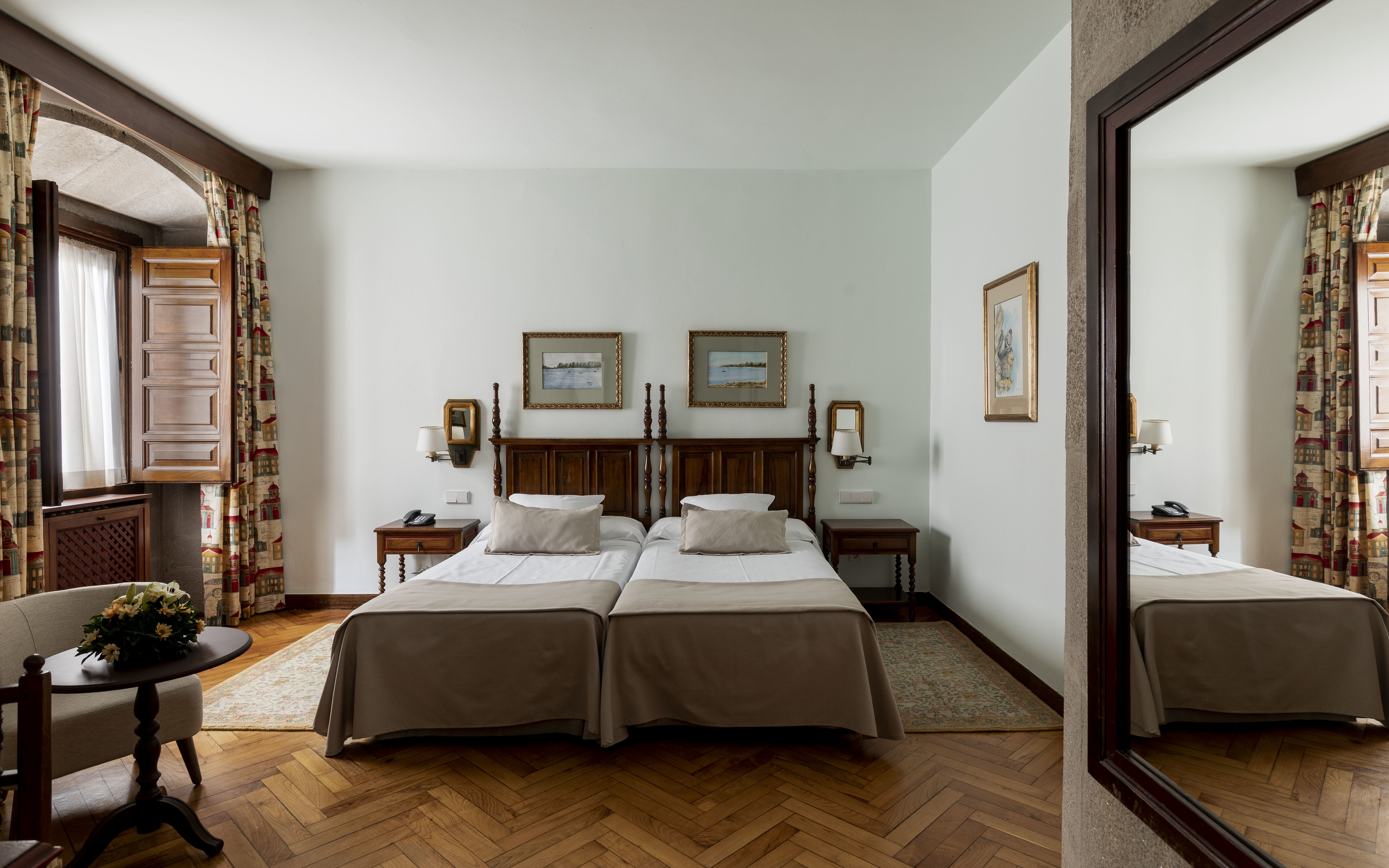 Parador de Pontevedra standard room, twin beds, wooden floors, shuttered windows, traditional decor