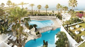 Puente Romano Marbella aerial shot of pools sun loungers beach in background