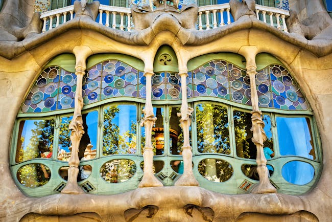 Modernist building in coloured glass and stone Casa Batilo by Gaudi in Barcelona