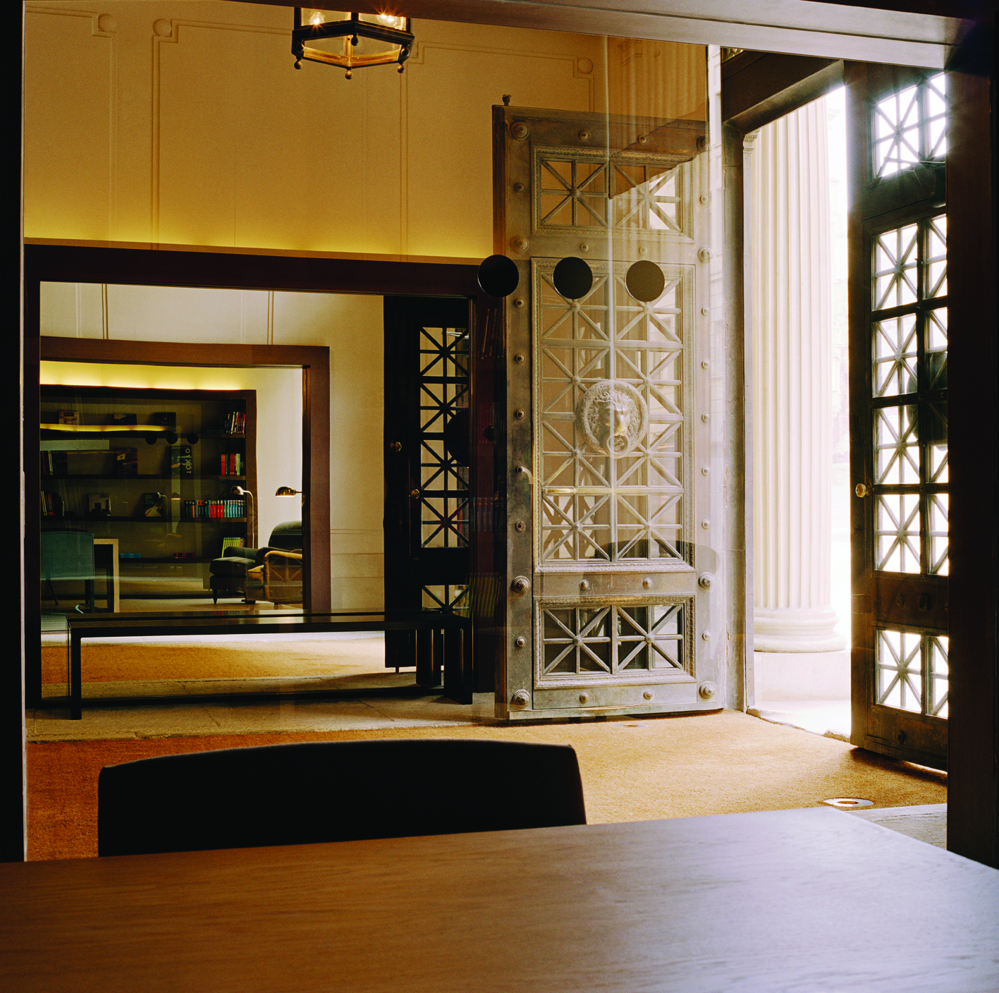 Grand Hotel Central Barcelona entrance large wooden doors stone tiles