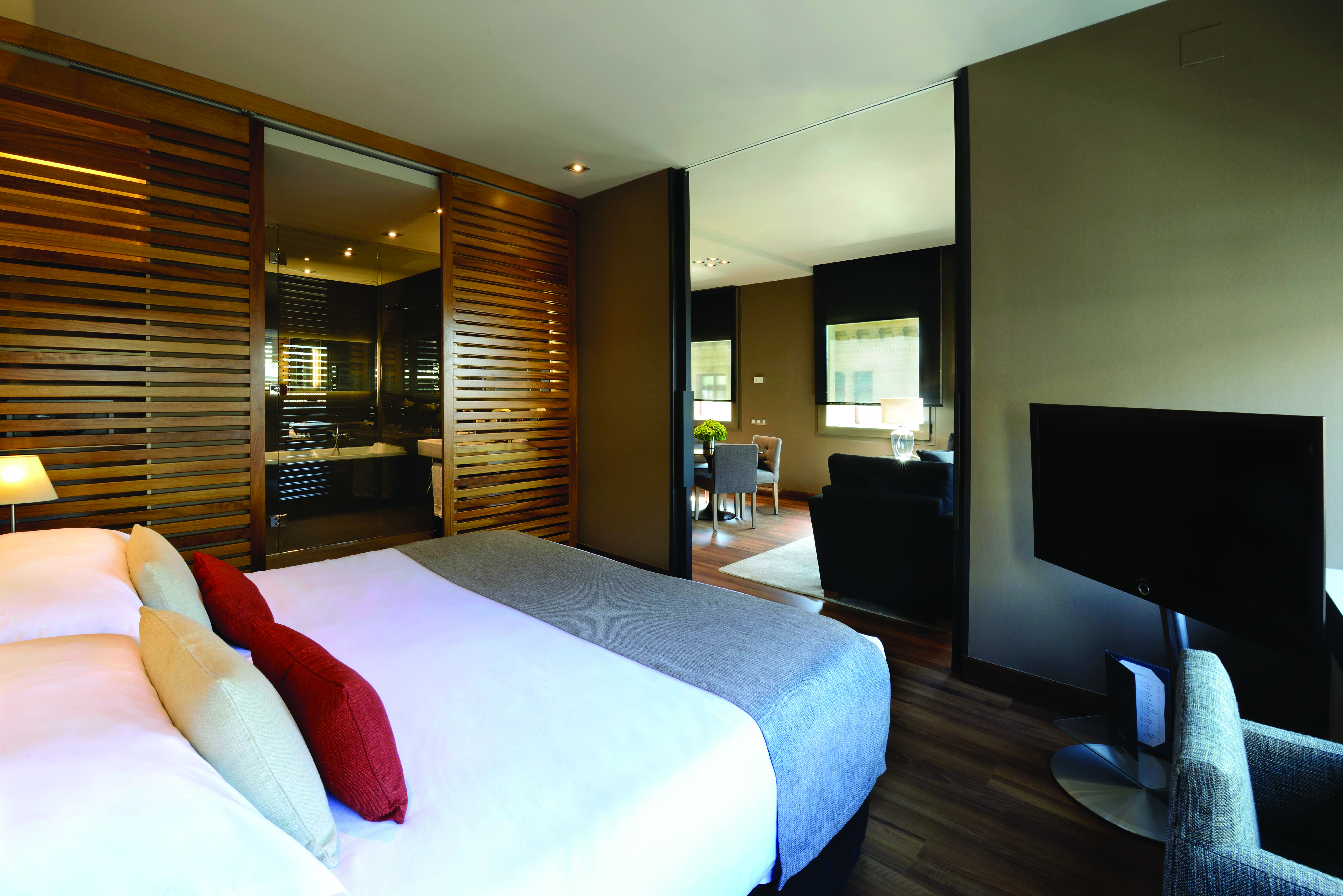 Grand Hotel Central Barcelona grand suite bedroom living area contemporary décor