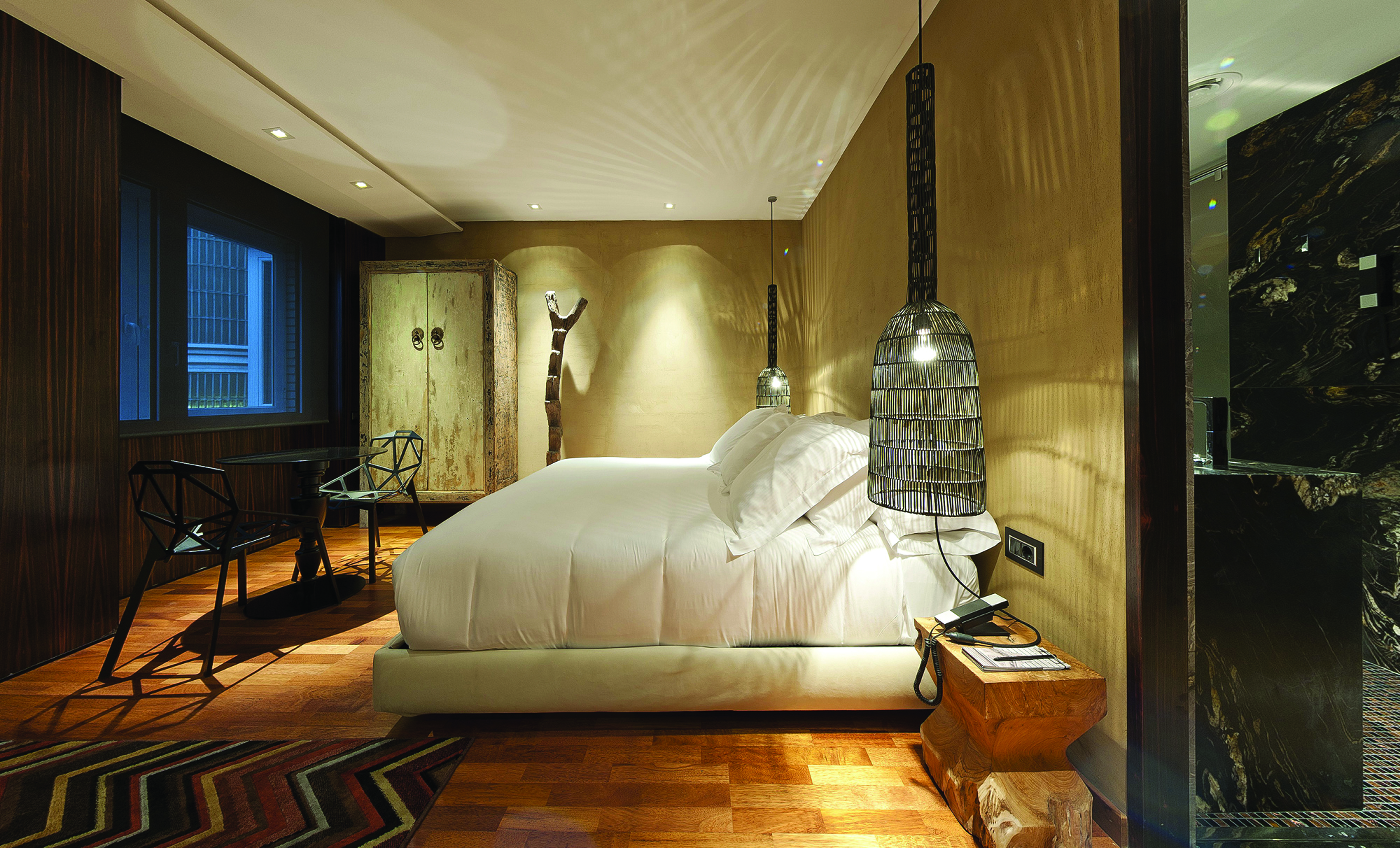 Hotel Claris Barcelona junior suite  bed chairs stylish décor