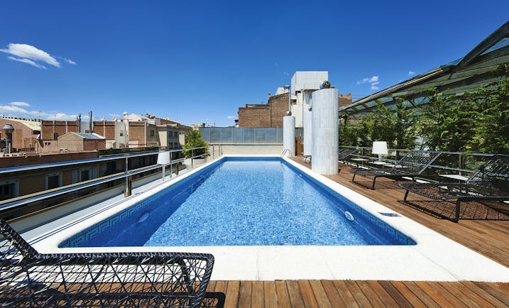 Hotel Claris Barcelona pool sun loungers views of city