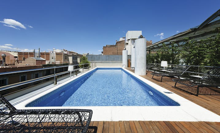 Hotel Claris Barcelona pool sun loungers views of city
