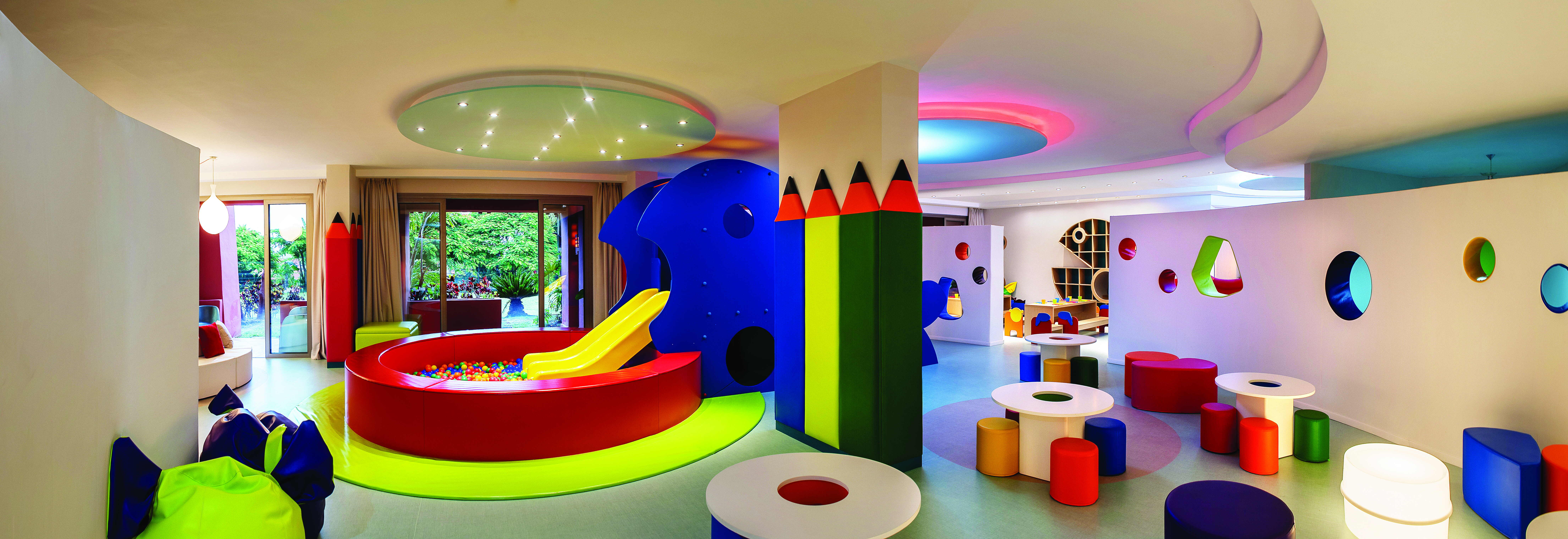 Abama Tenerife kids  slide ball pit bold colours play room