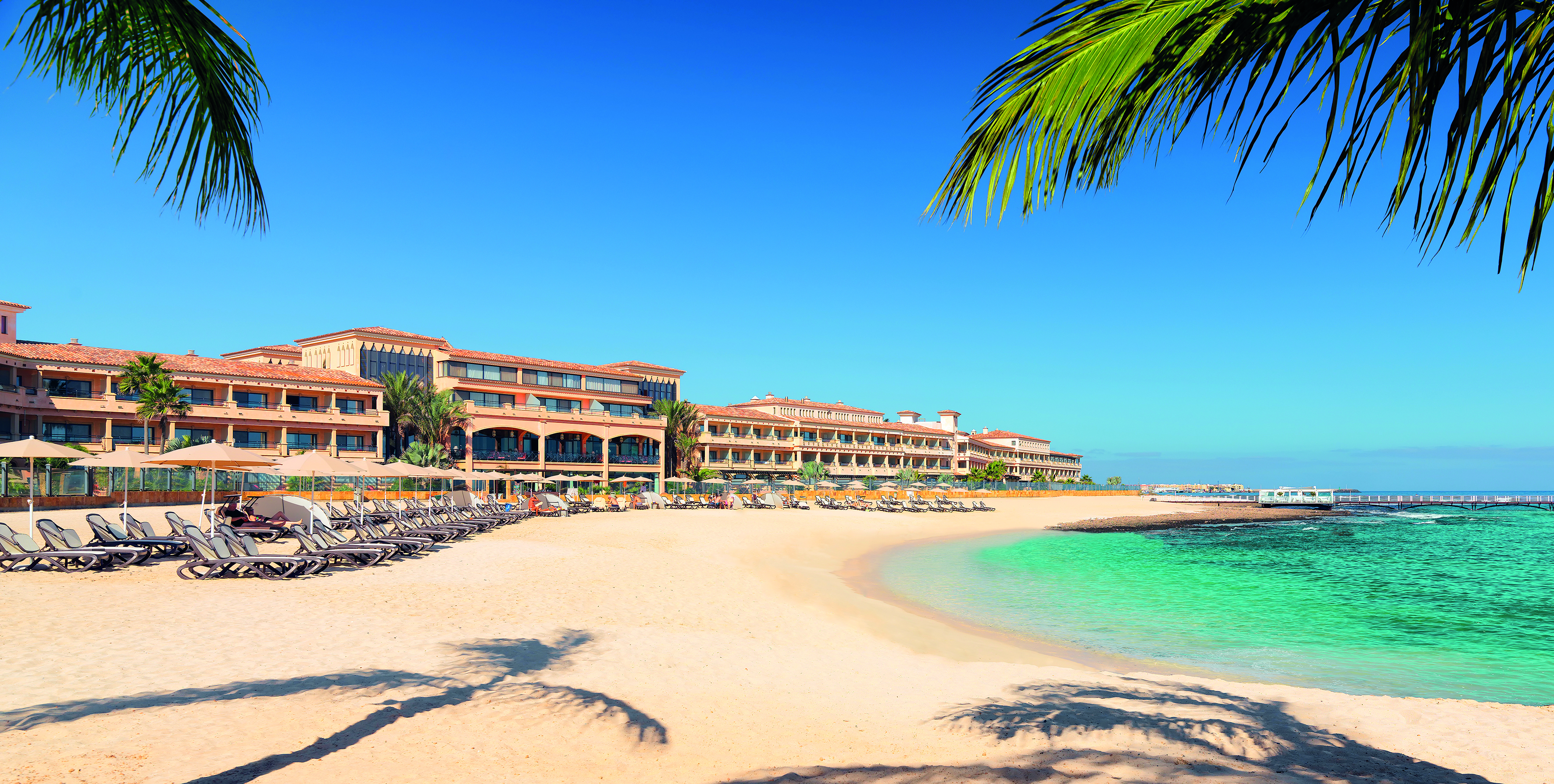 Gran Hotel Atlantis Bahia Fuerteventura beach sun loungers sandy beach palm trees
