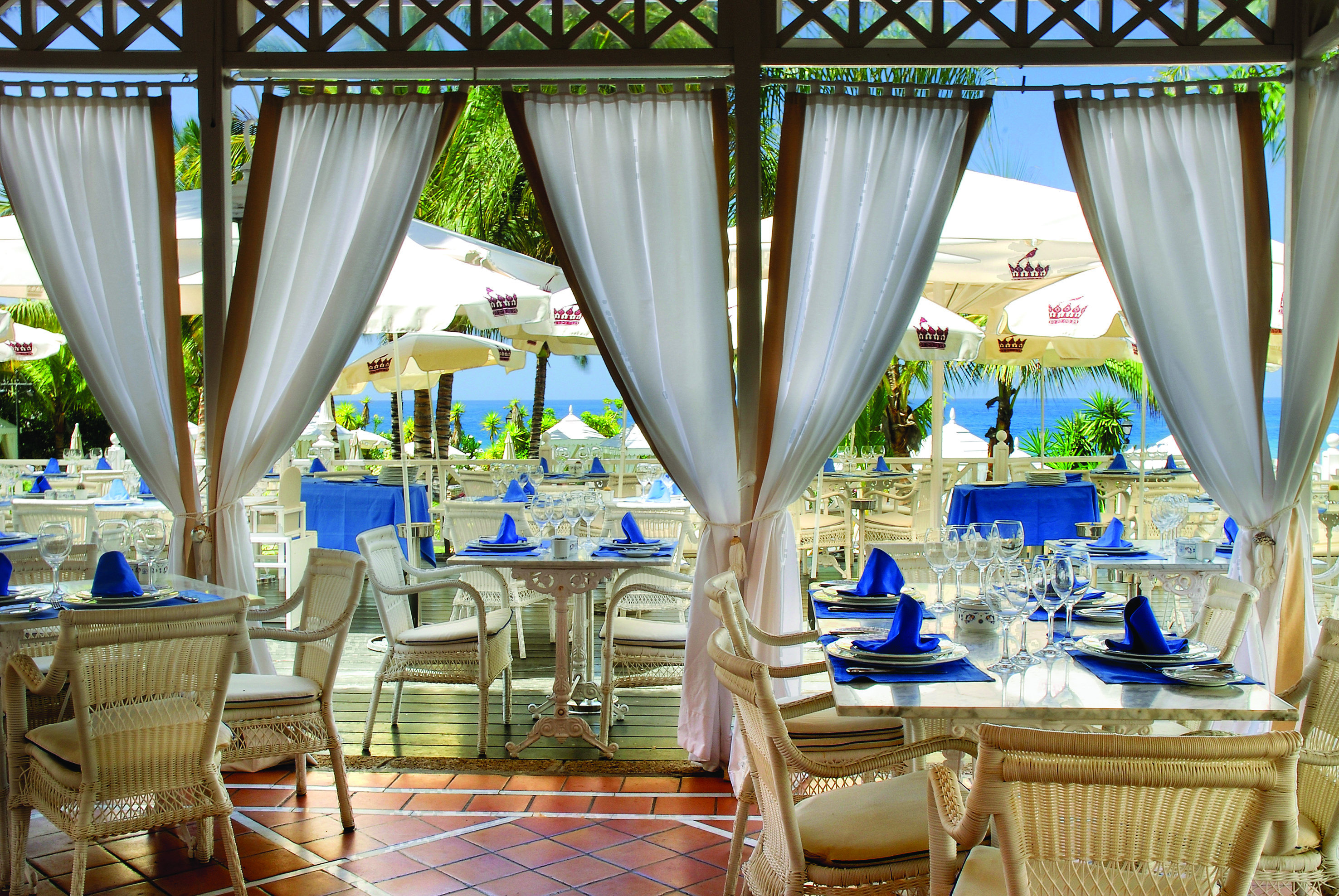 Gran Hotel Bahia Del Duque Tenerife restaurant with indoor and outdoor dining area and sea view
