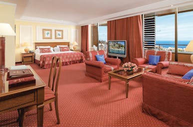 Hotel Botanico Tenerife ambassador junior suite bed lounge area traditional décor