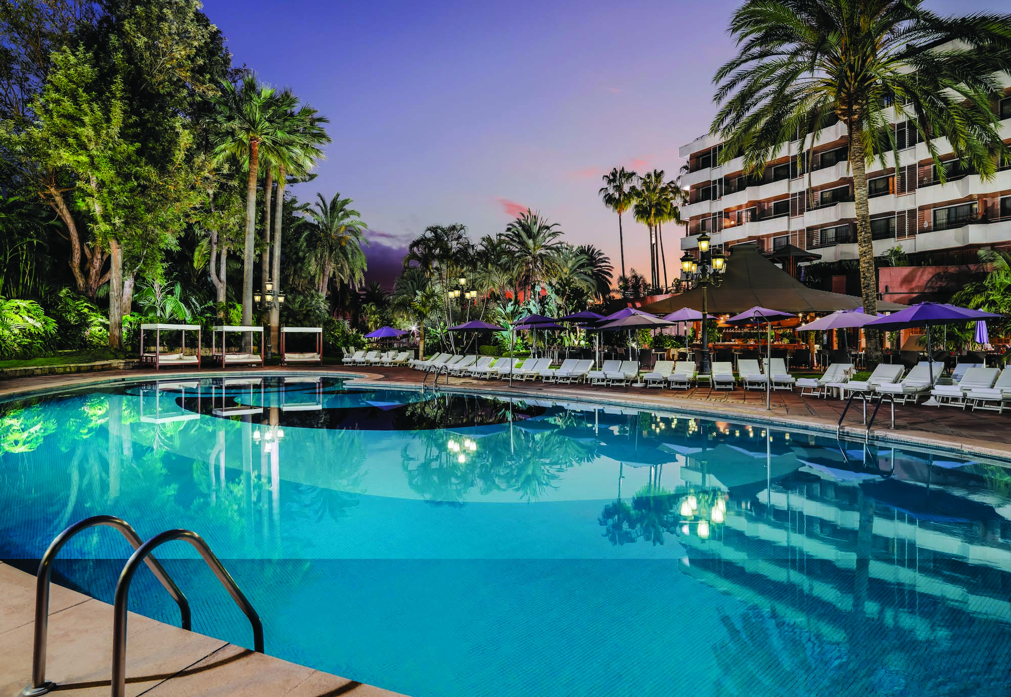 Hotel Botanico Tenerife exterior pool sun loungers hotel in background