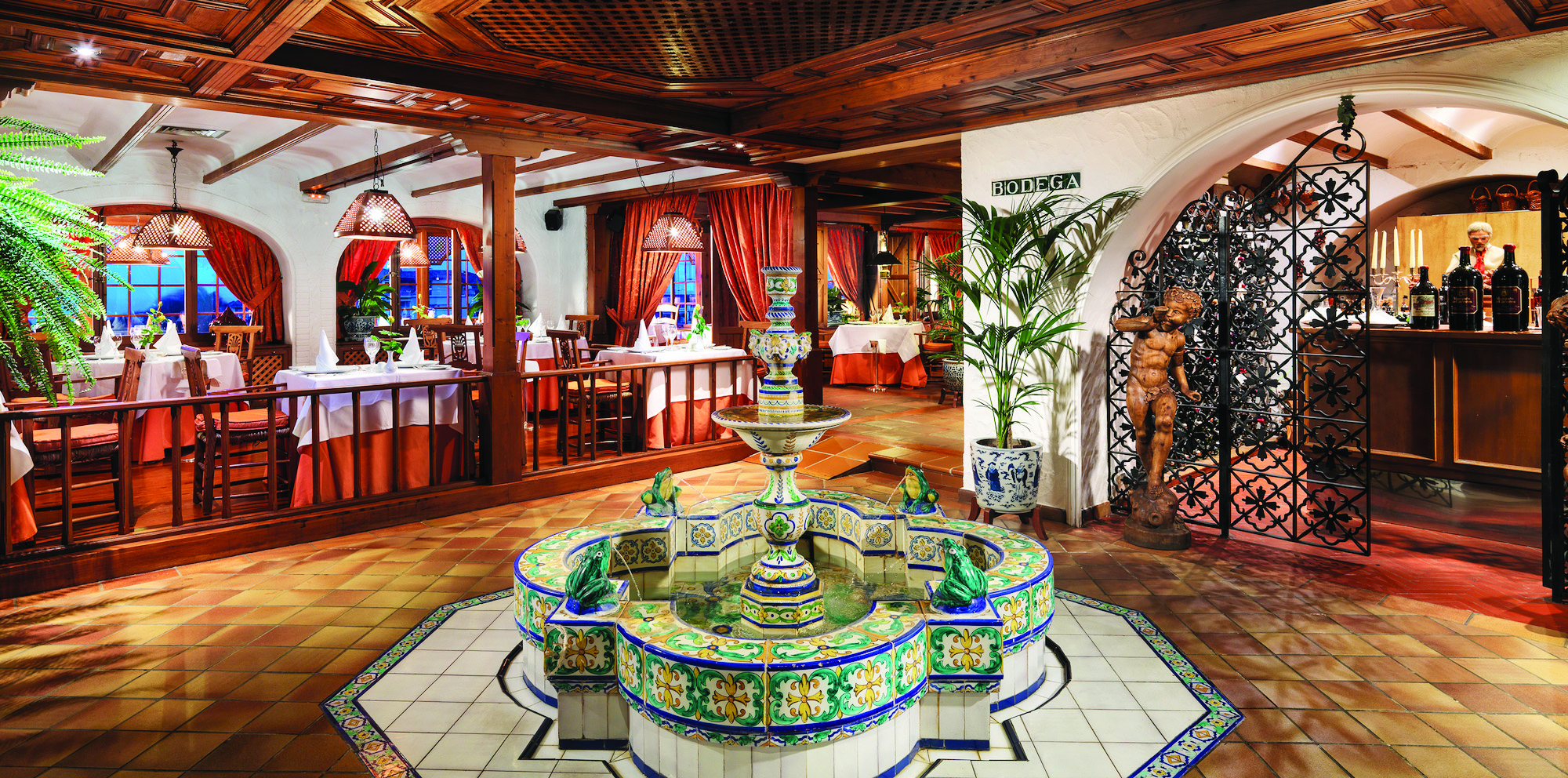 Hotel Botanico Tenerife La Parrilla restaurant indoor dining rustic décor water feature