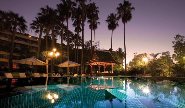 Hotel Botanico Tenerife pool night umbrellas trees hotel in background
