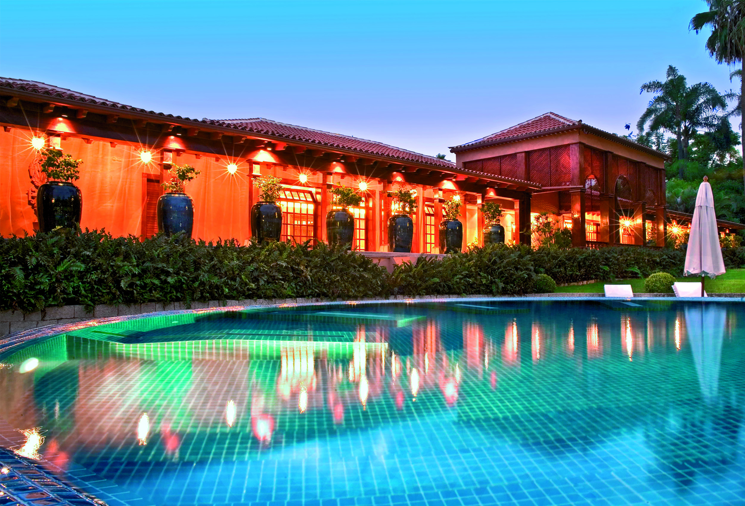 Hotel Botanico Tenerife pool umbrella hotel in background