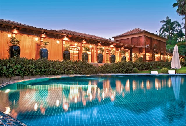 Hotel Botanico Tenerife pool umbrella hotel in background