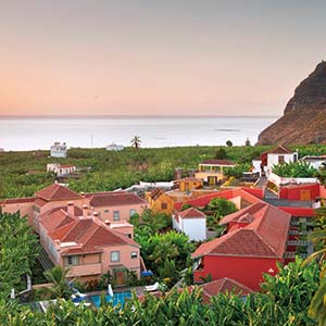 Hacienda de Abajo Canary Islands exterior hotel buildings countryside surrounds sea in background