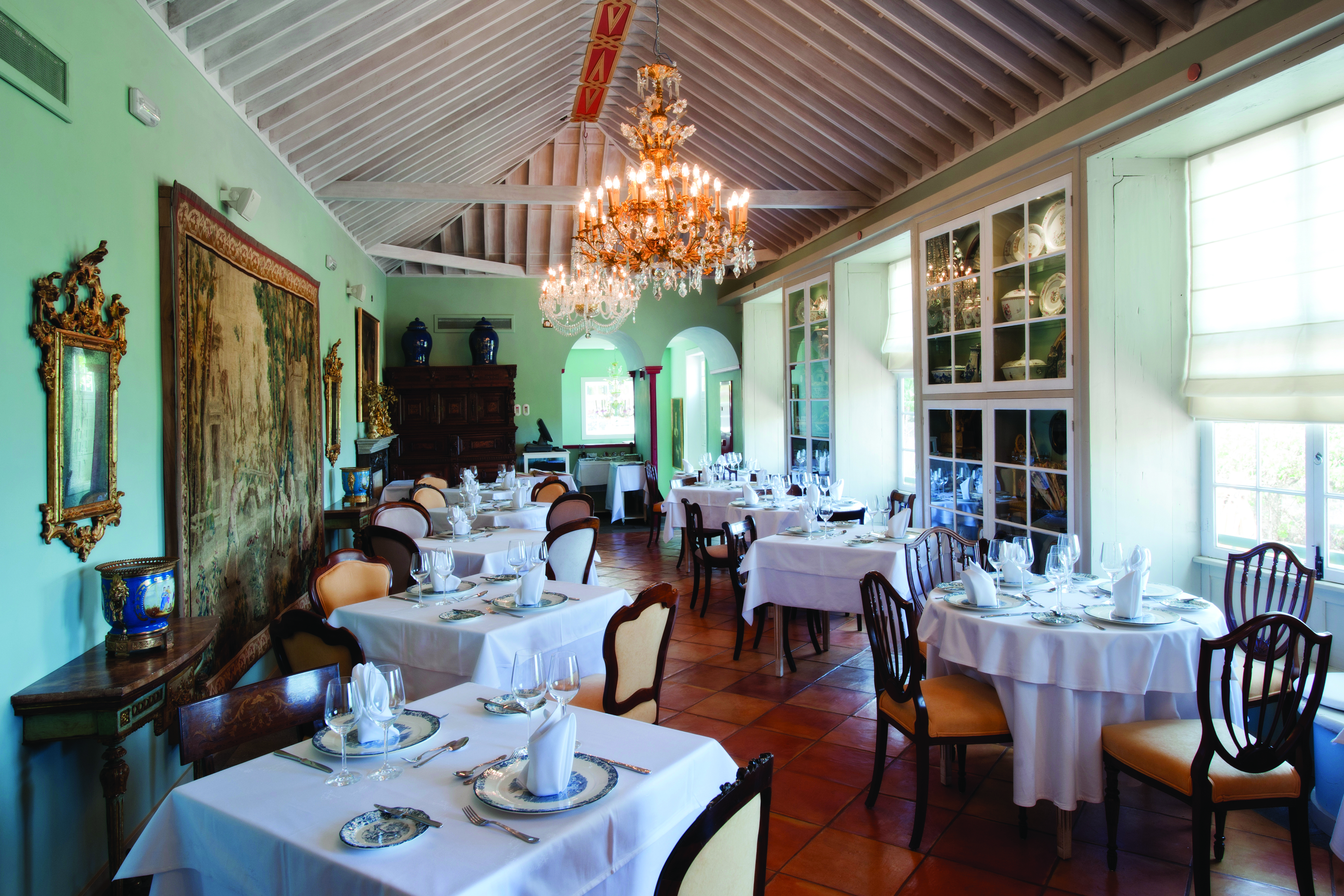 Hacienda de Abajo Canary Islands restaurant indoor dining area ornate décor chandelier artwork