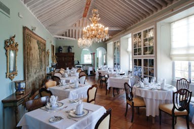 Hacienda de Abajo Canary Islands restaurant indoor dining area ornate décor chandelier artwork