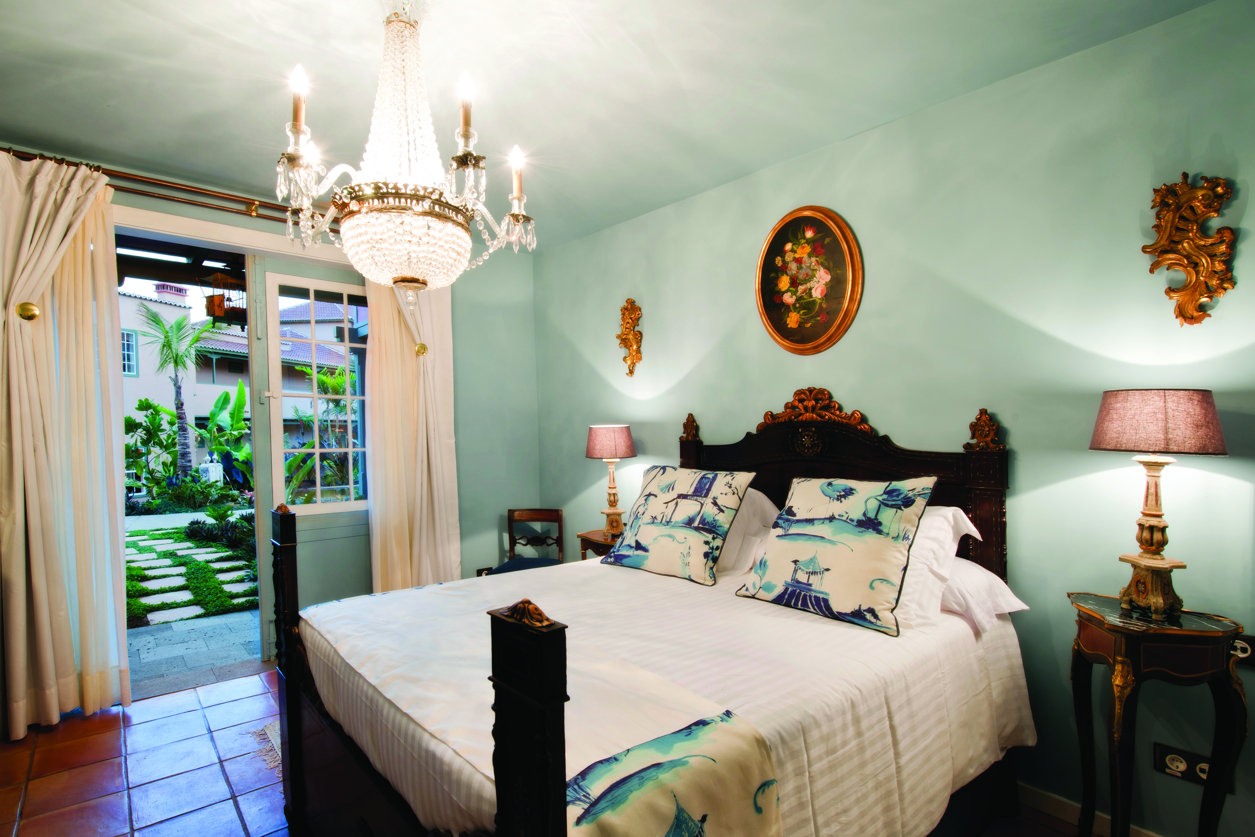 Hacienda de Abajo Canary Islands superior bedroom chandelier bed ornate décor garden terrace