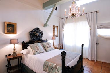Hacienda de Abajo Canary Islands superior guestroom bed chandelier elegant décor