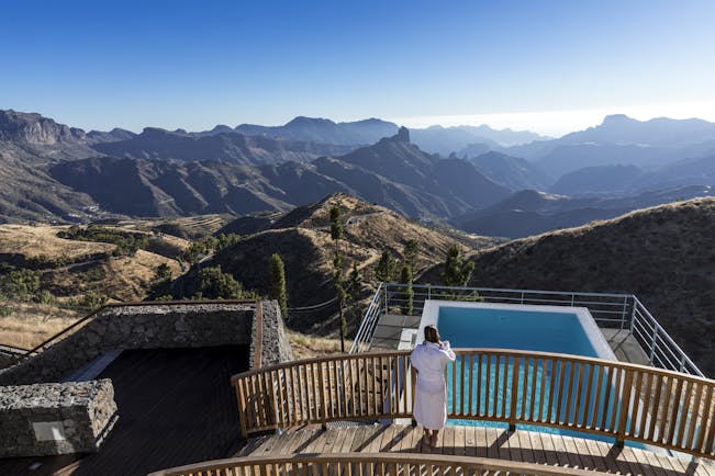 Swimming pool with views over mountainous area